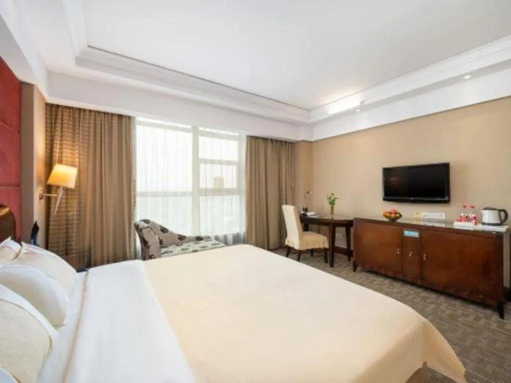 Bed in Chinflux Mandarin Hotel