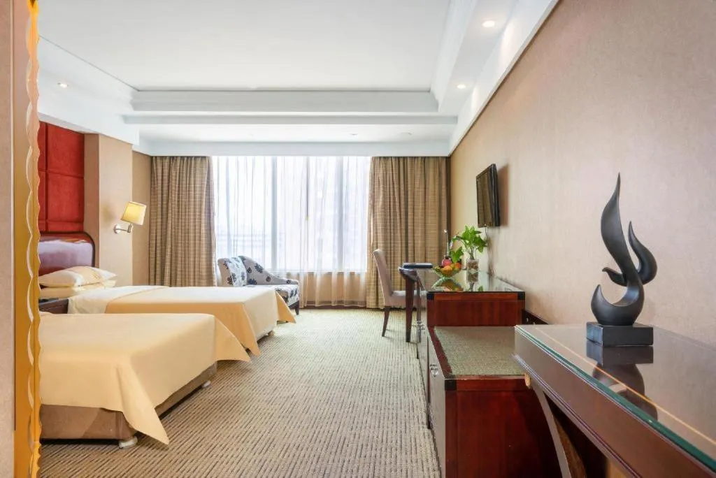 Bed in Chinflux Mandarin Hotel