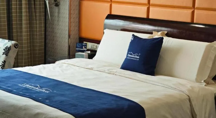 Bed in Chinflux Mandarin Hotel
