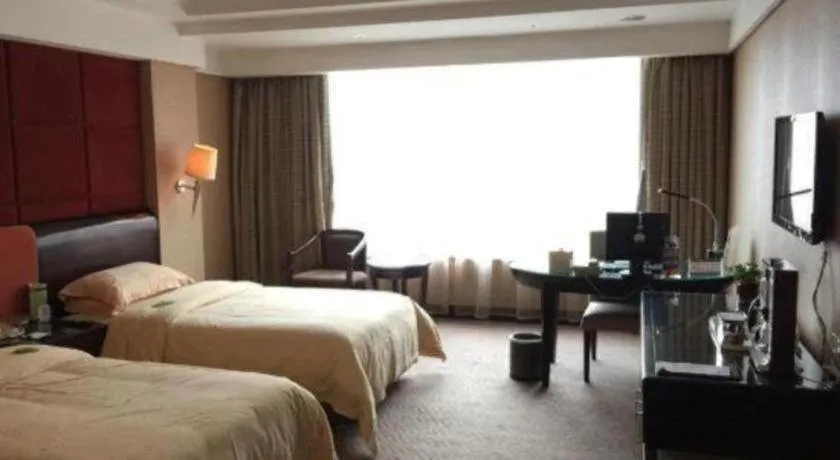 Bed in Chinflux Mandarin Hotel