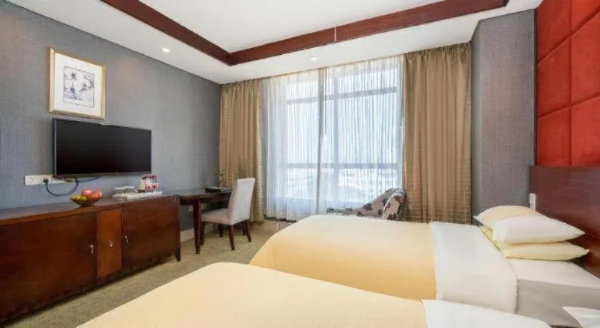 Bed in Chinflux Mandarin Hotel