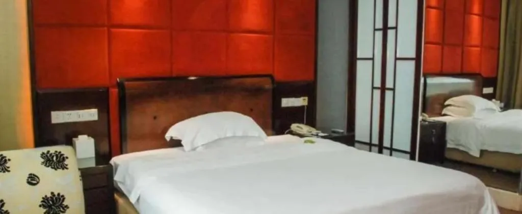 Bed in Chinflux Mandarin Hotel