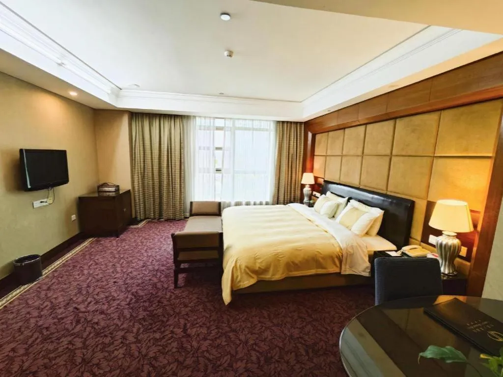 Bed in Chinflux Mandarin Hotel