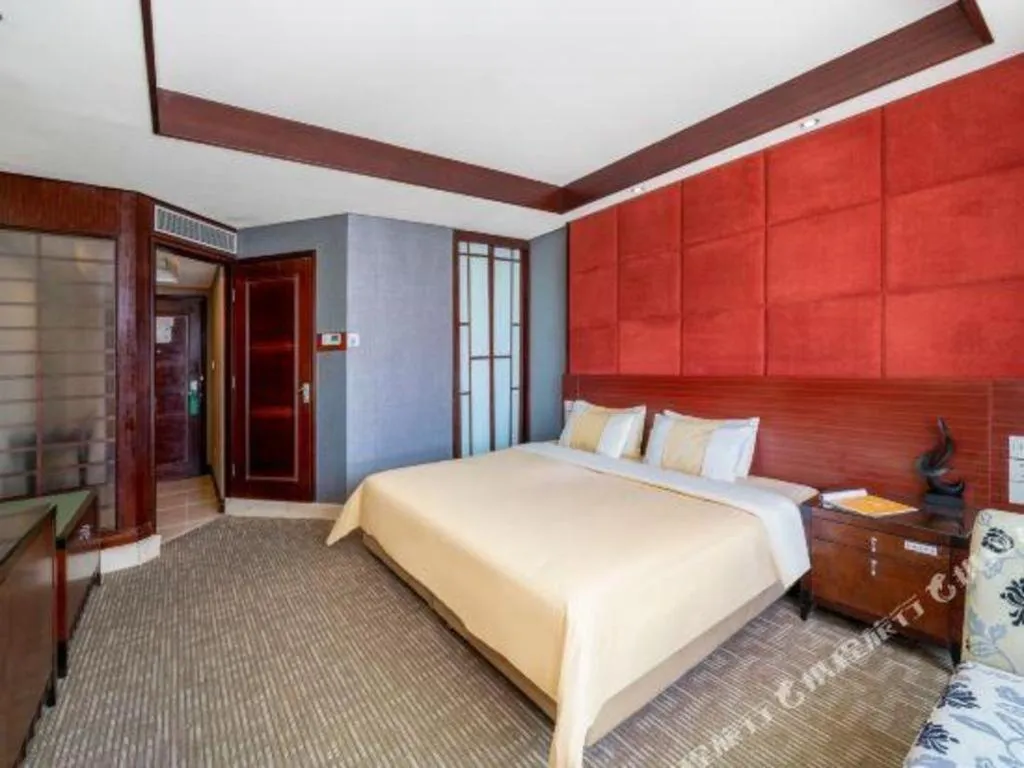 Bed in Chinflux Mandarin Hotel