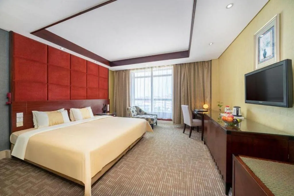 Bed in Chinflux Mandarin Hotel