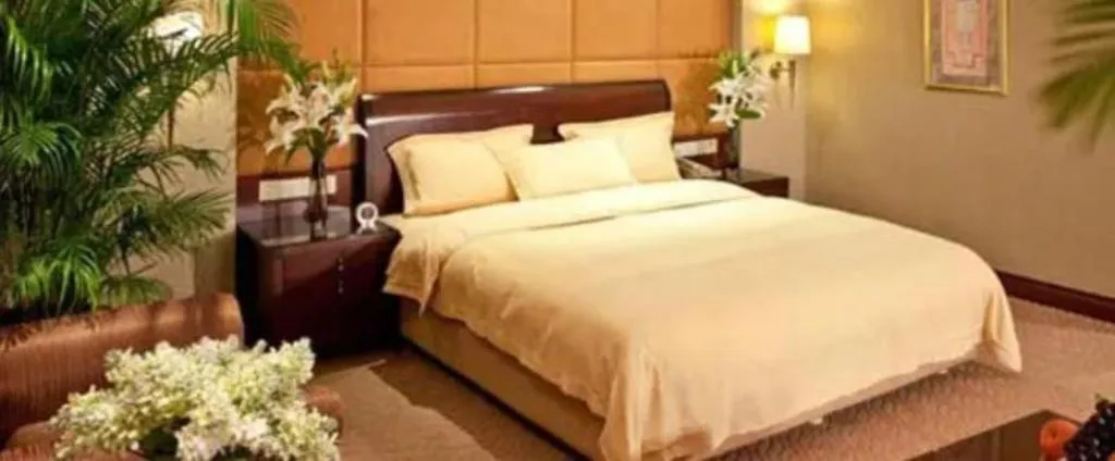 Bed in Chinflux Mandarin Hotel