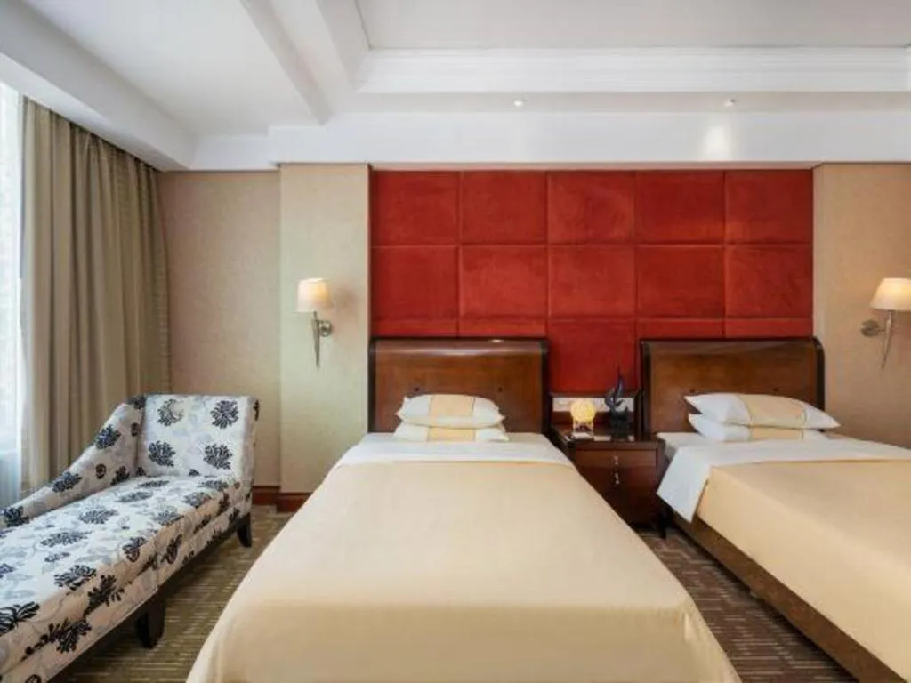 Bed in Chinflux Mandarin Hotel