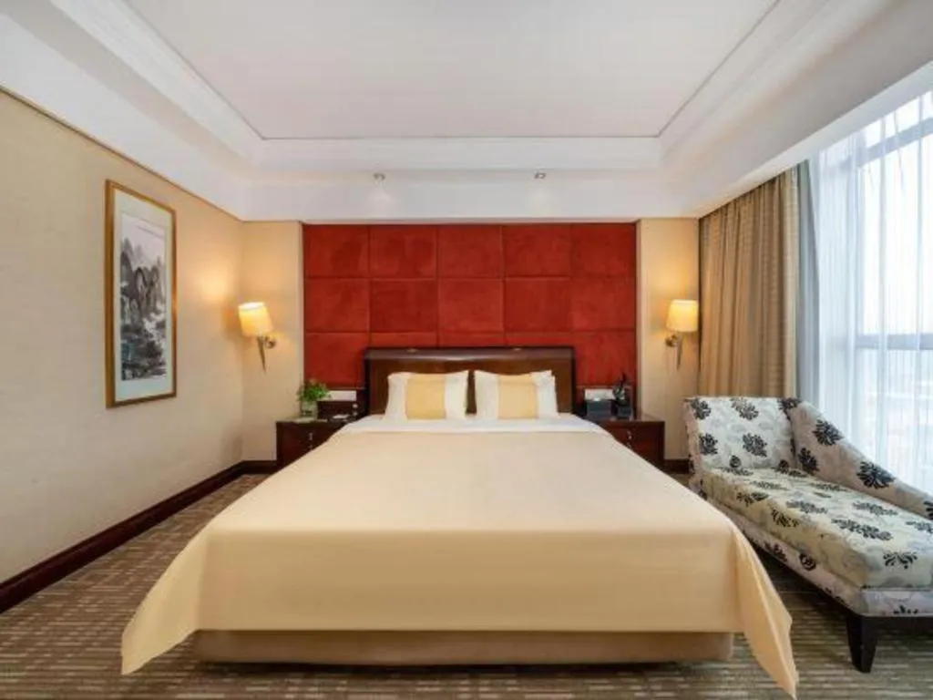 Bed in Chinflux Mandarin Hotel