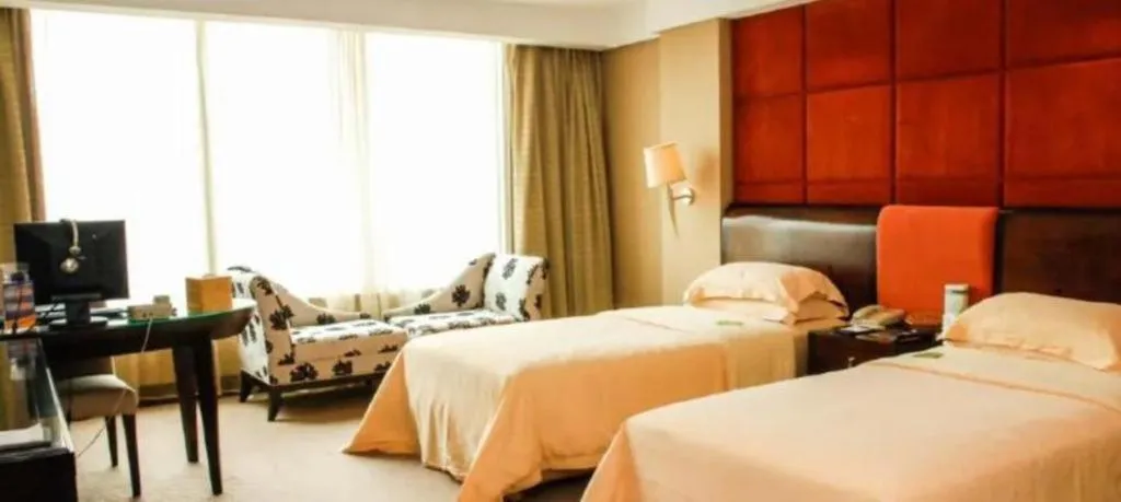 Bed in Chinflux Mandarin Hotel