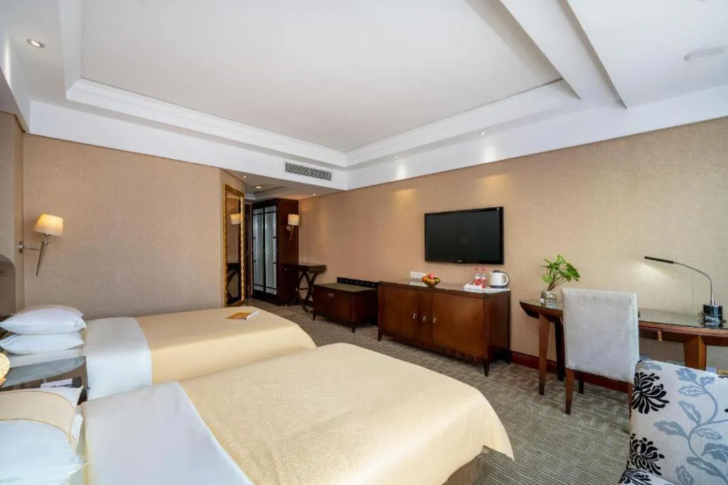 Bed in Chinflux Mandarin Hotel