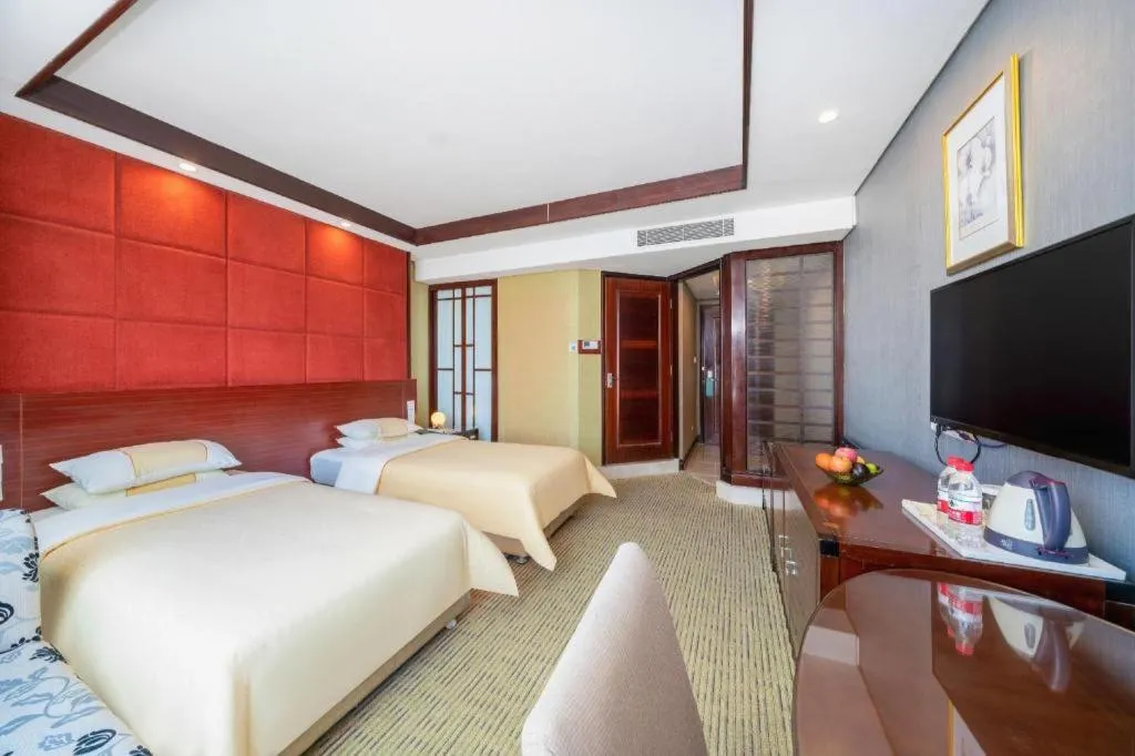 Bed in Chinflux Mandarin Hotel