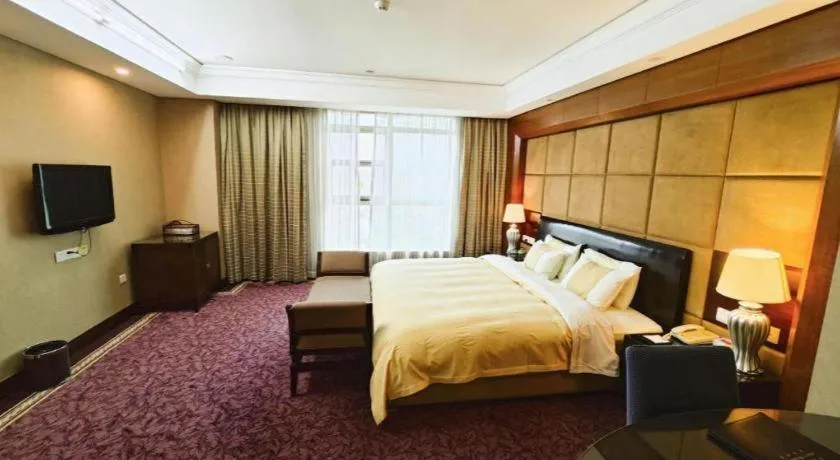 Bed in Chinflux Mandarin Hotel