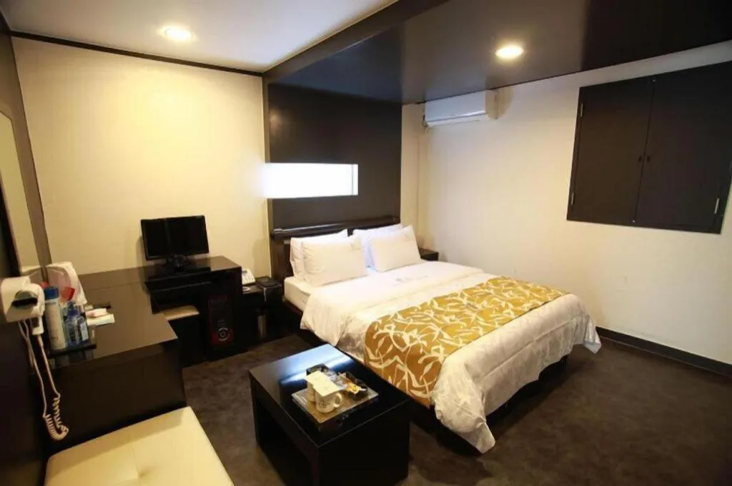 Bed in Goodstay Lanuit Hotel