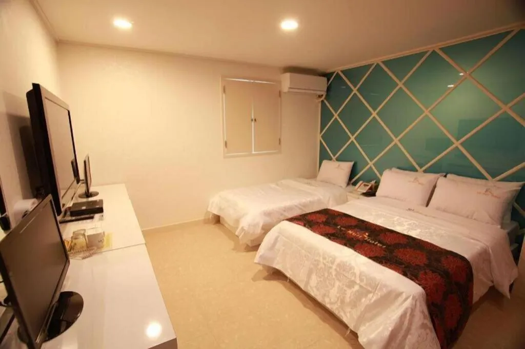 Bed in Goodstay Lanuit Hotel
