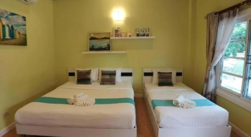 Bed in Chiangkhan Gallery Resort