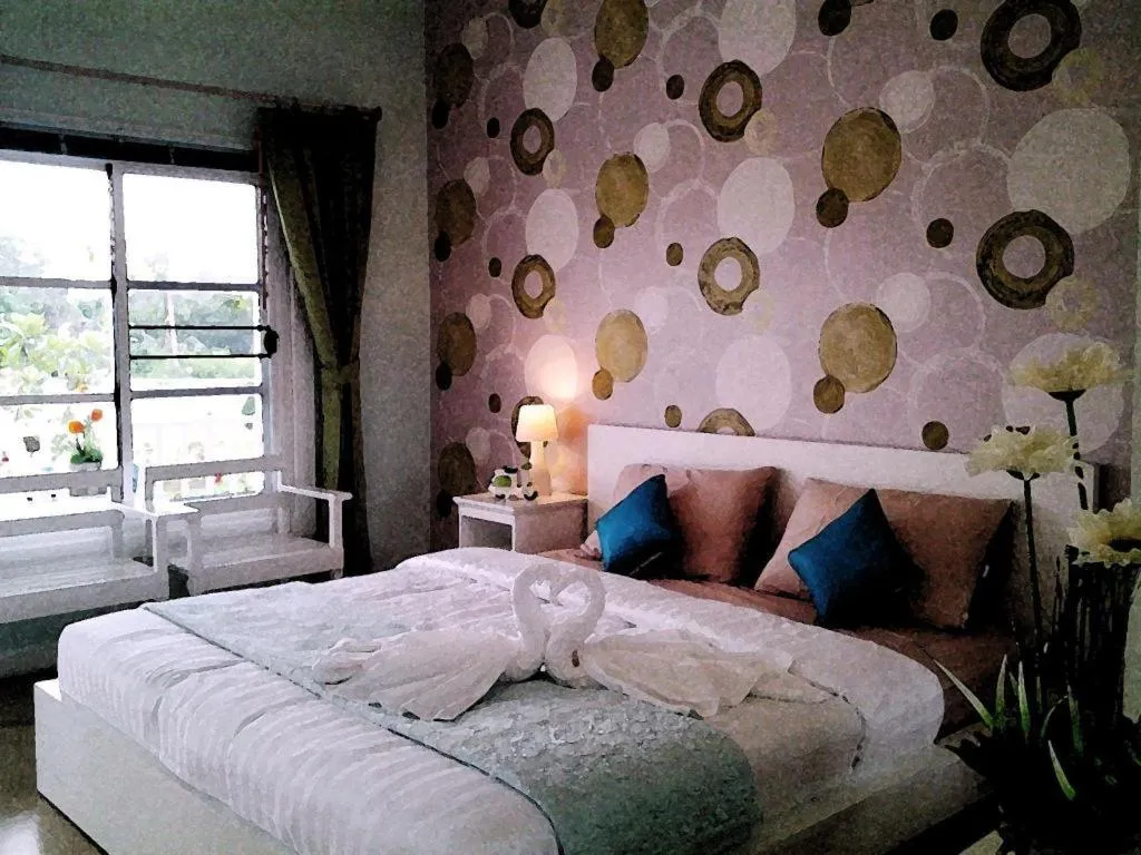 Bed in Chiangkhan Gallery Resort