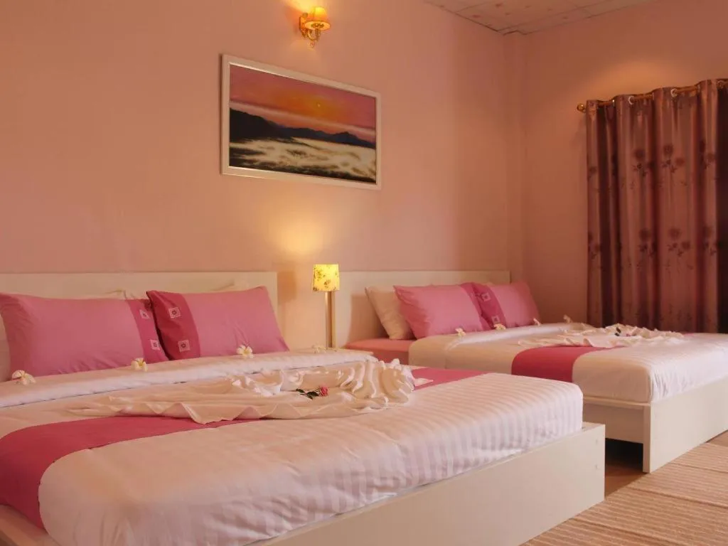 Bed in Chiangkhan Gallery Resort