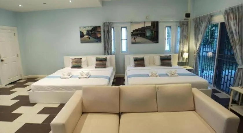 Bed in Chiangkhan Gallery Resort