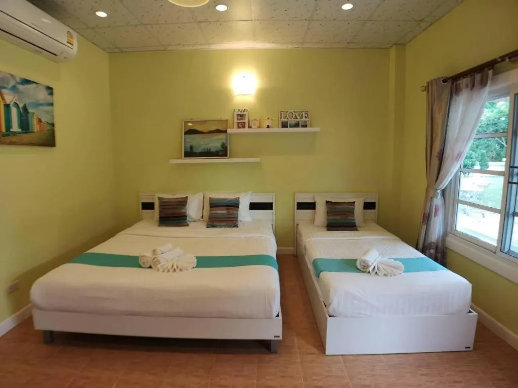 Bed in Chiangkhan Gallery Resort