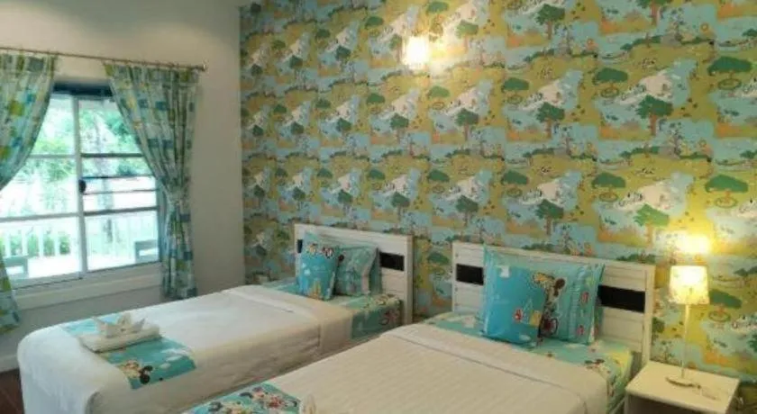 Bed in Chiangkhan Gallery Resort