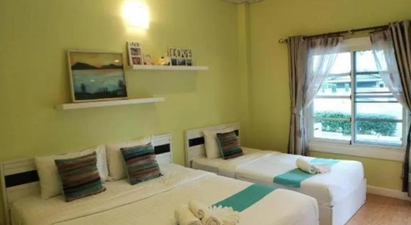 Bed in Chiangkhan Gallery Resort