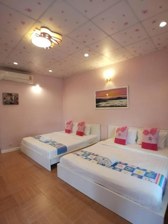 Bed in Chiangkhan Gallery Resort