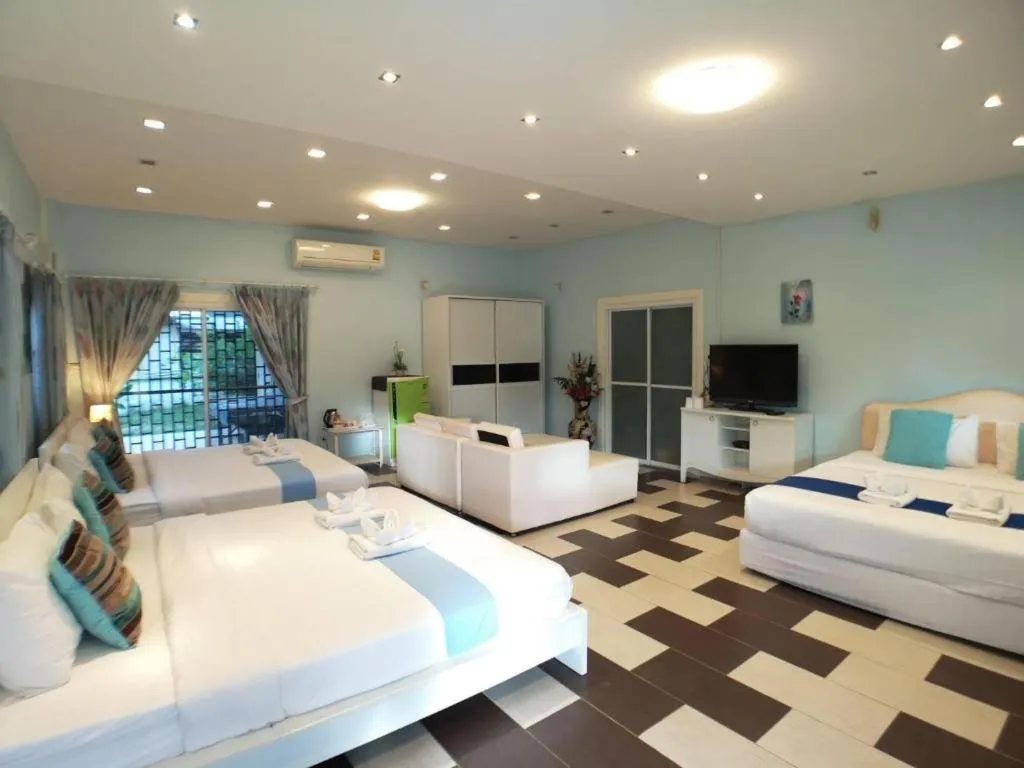 Bed in Chiangkhan Gallery Resort