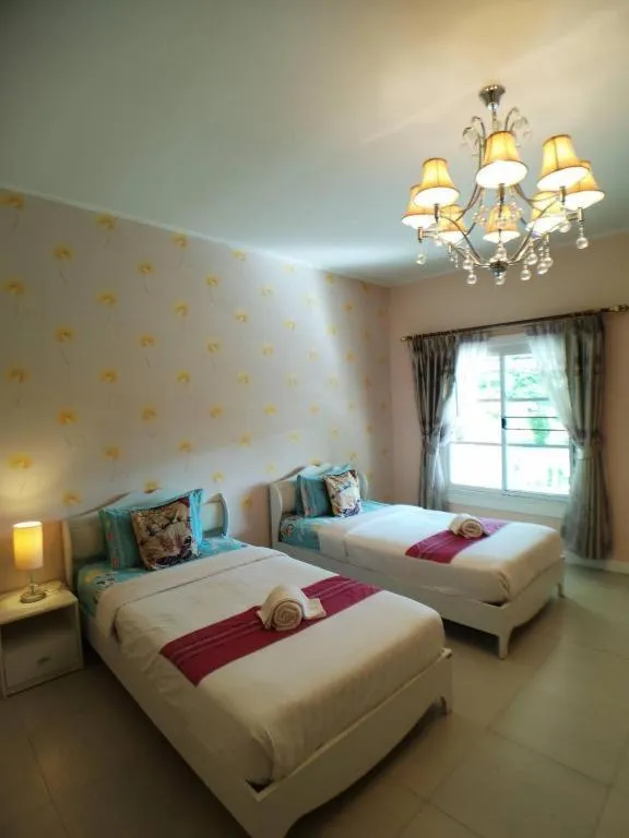 Bed in Chiangkhan Gallery Resort