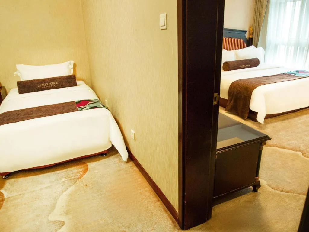 Bed in James Joyce Coffetel Qinhuangdao Taiyangcheng Wenhua Road