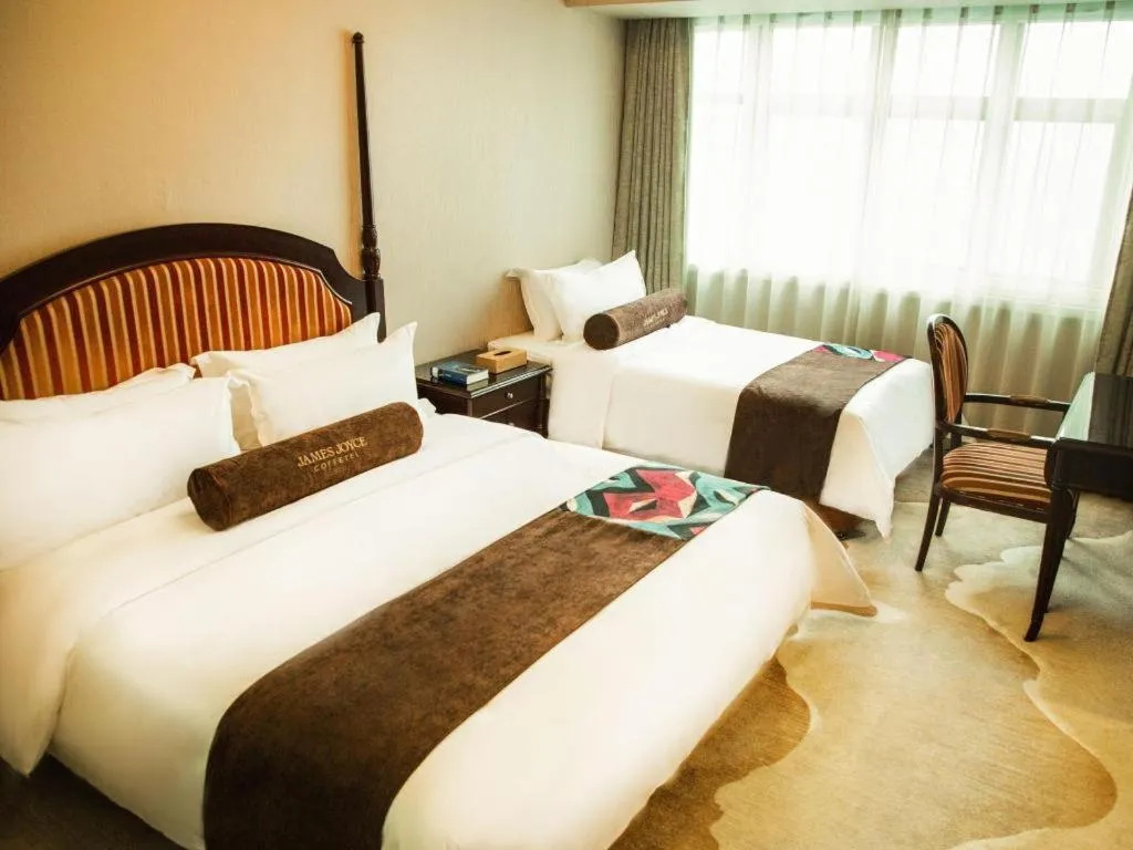 Bed in James Joyce Coffetel Qinhuangdao Taiyangcheng Wenhua Road