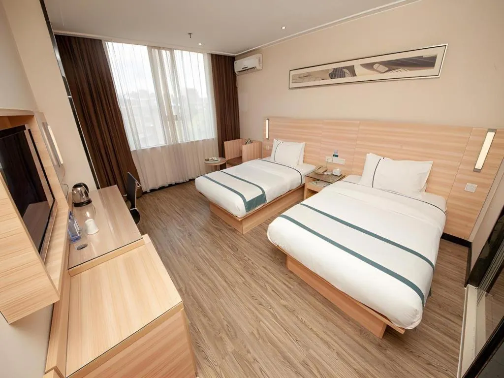 Bed in City Comfort Inn Yulin Wenhua Square Wanda Plaza