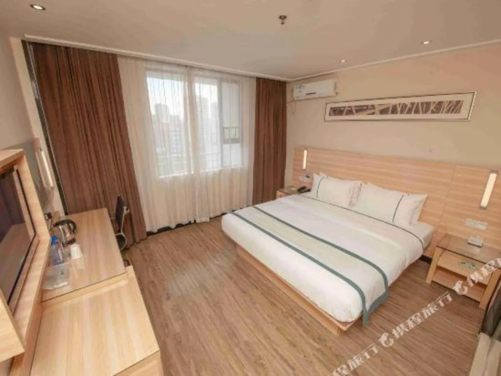 Bed in City Comfort Inn Yulin Wenhua Square Wanda Plaza