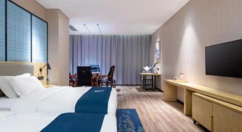 Bed in Echarm Hotel Danzhou Xiari Plaza