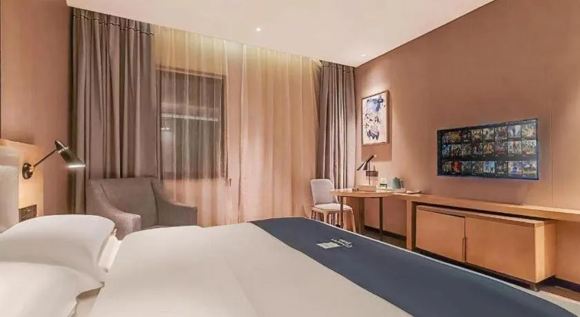 Bed in Echarm Hotel Danzhou Xiari Plaza