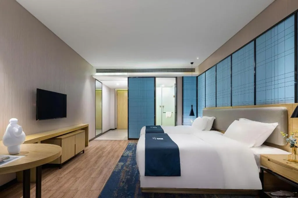 Bed in Echarm Hotel Danzhou Xiari Plaza