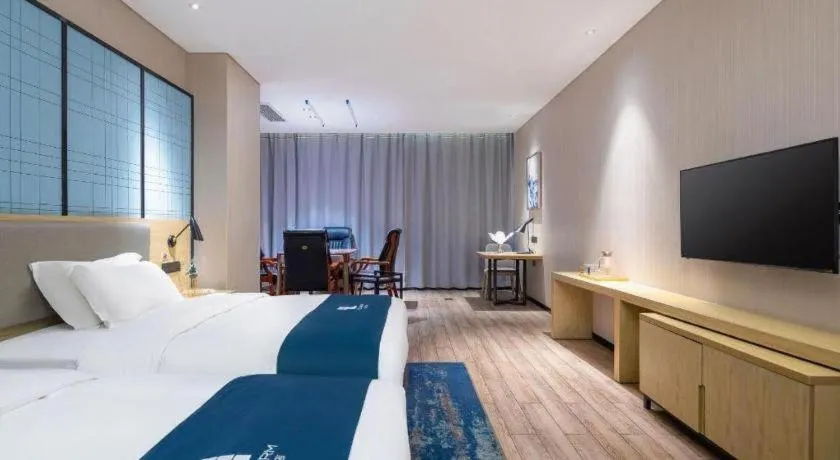 Bed in Echarm Hotel Danzhou Xiari Plaza