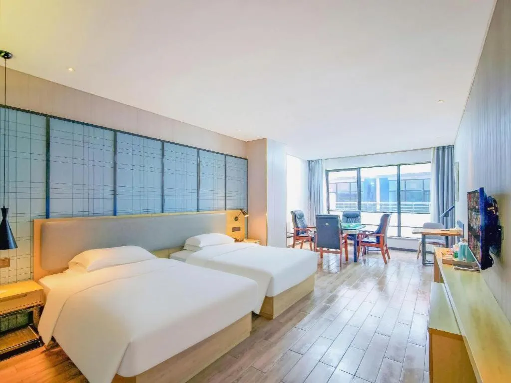 Bed in Echarm Hotel Danzhou Xiari Plaza