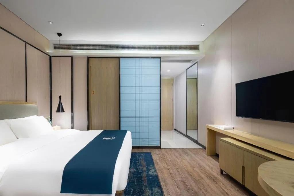 Bed in Echarm Hotel Danzhou Xiari Plaza