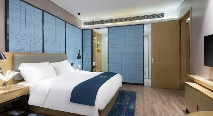 Bed in Echarm Hotel Danzhou Xiari Plaza