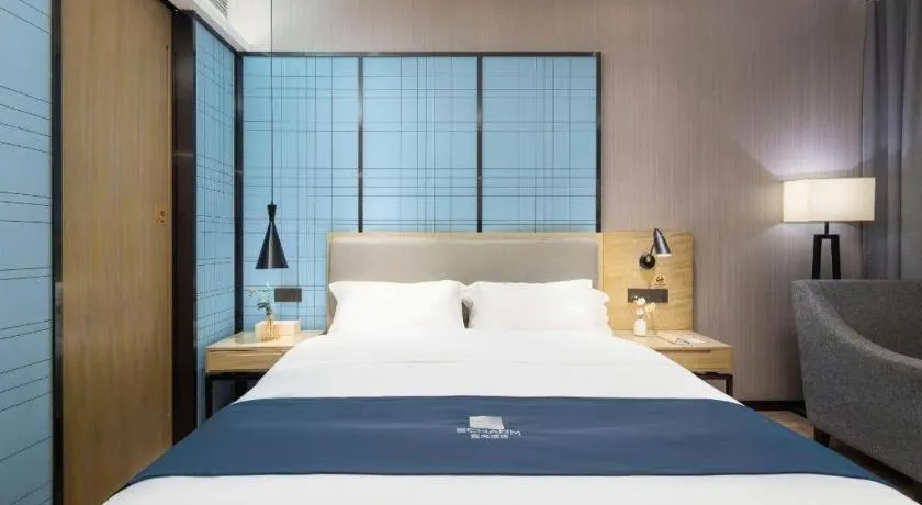 Bed in Echarm Hotel Danzhou Xiari Plaza