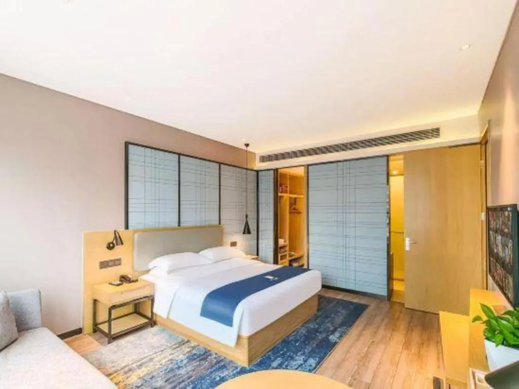 Bed in Echarm Hotel Danzhou Xiari Plaza