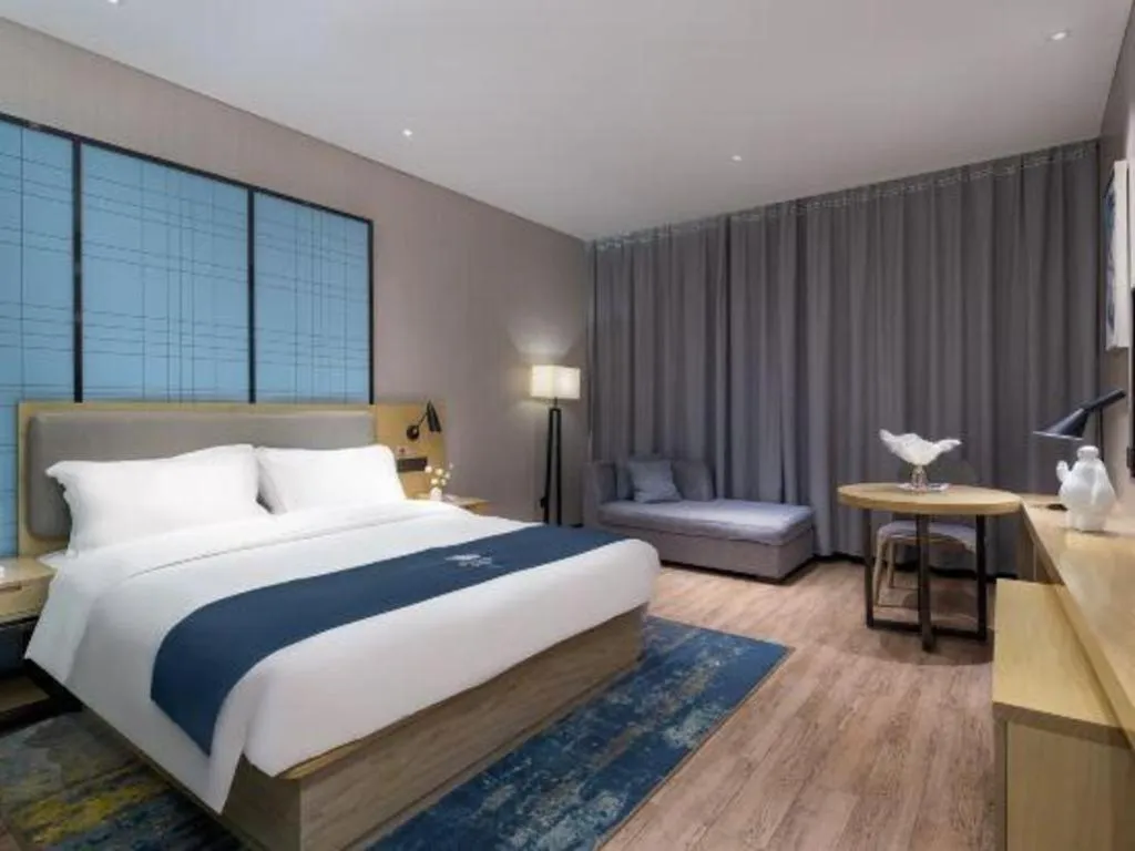 Bed in Echarm Hotel Danzhou Xiari Plaza