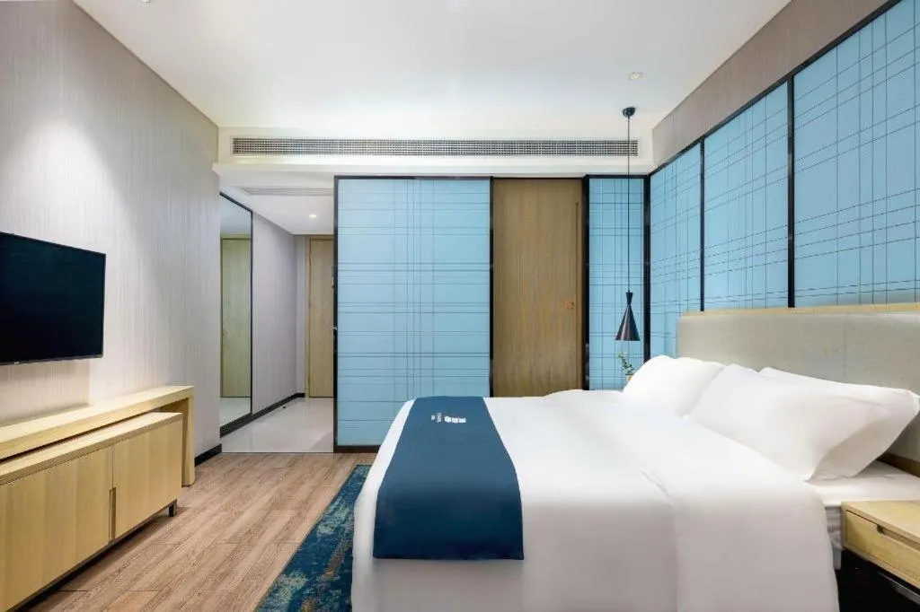 Bed in Echarm Hotel Danzhou Xiari Plaza