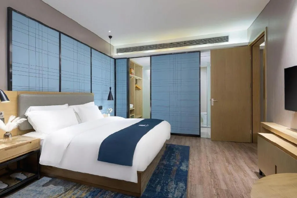 Bed in Echarm Hotel Danzhou Xiari Plaza