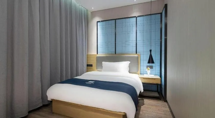 Bed in Echarm Hotel Danzhou Xiari Plaza