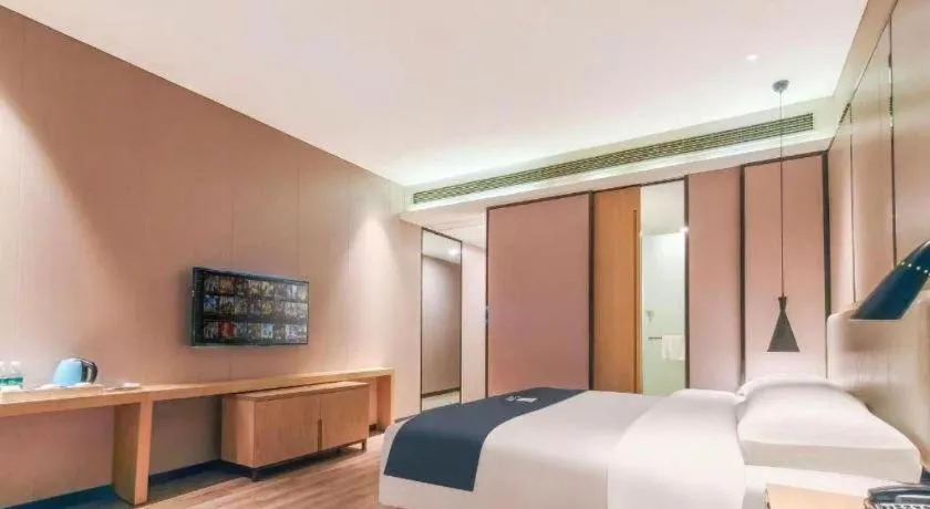 Bed in Echarm Hotel Danzhou Xiari Plaza