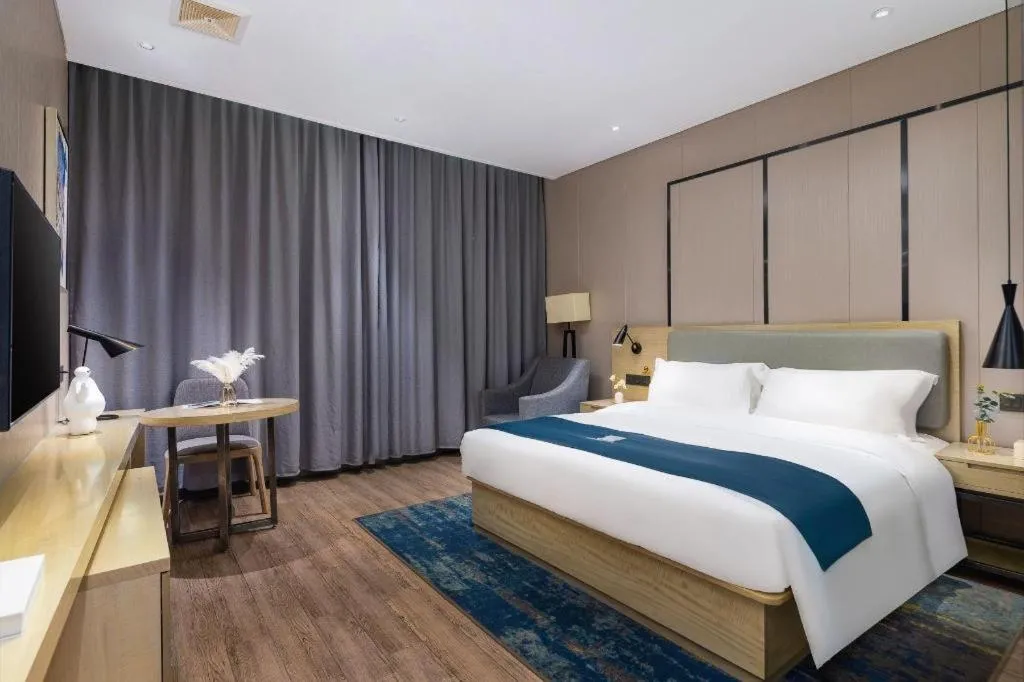 Bed in Echarm Hotel Danzhou Xiari Plaza