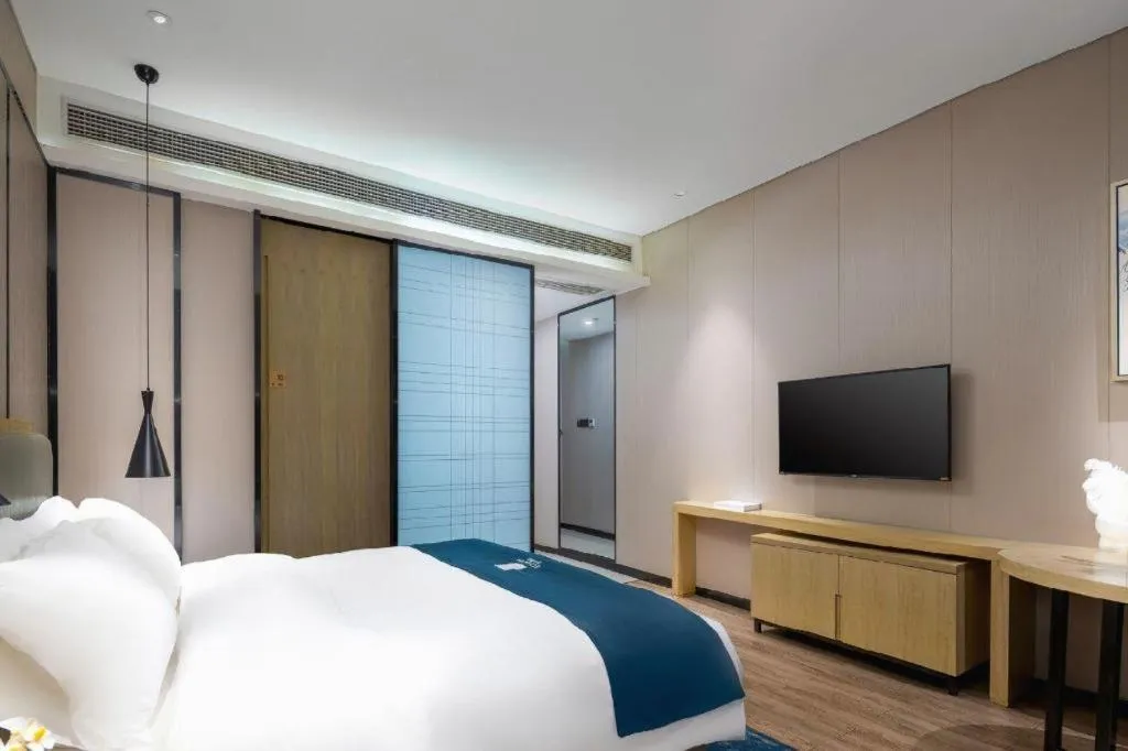 Bed in Echarm Hotel Danzhou Xiari Plaza