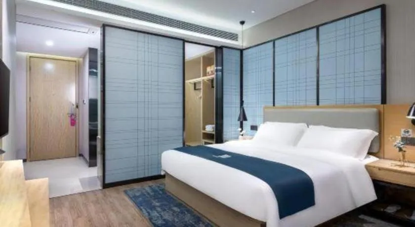 Bed in Echarm Hotel Danzhou Xiari Plaza