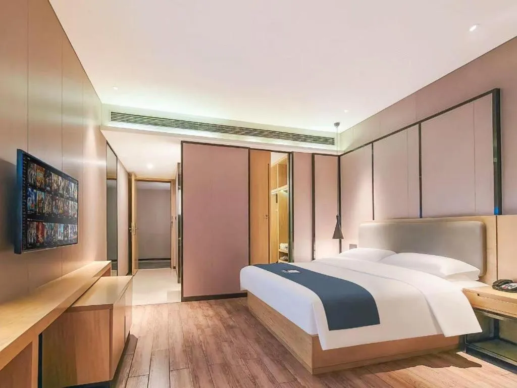 Bed in Echarm Hotel Danzhou Xiari Plaza